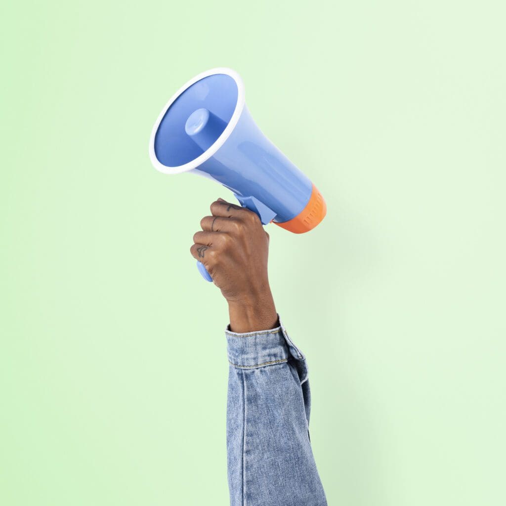 Hand holding megaphone marketing announcement campaign